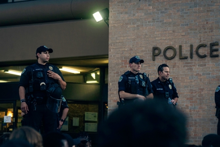 police standing outside building